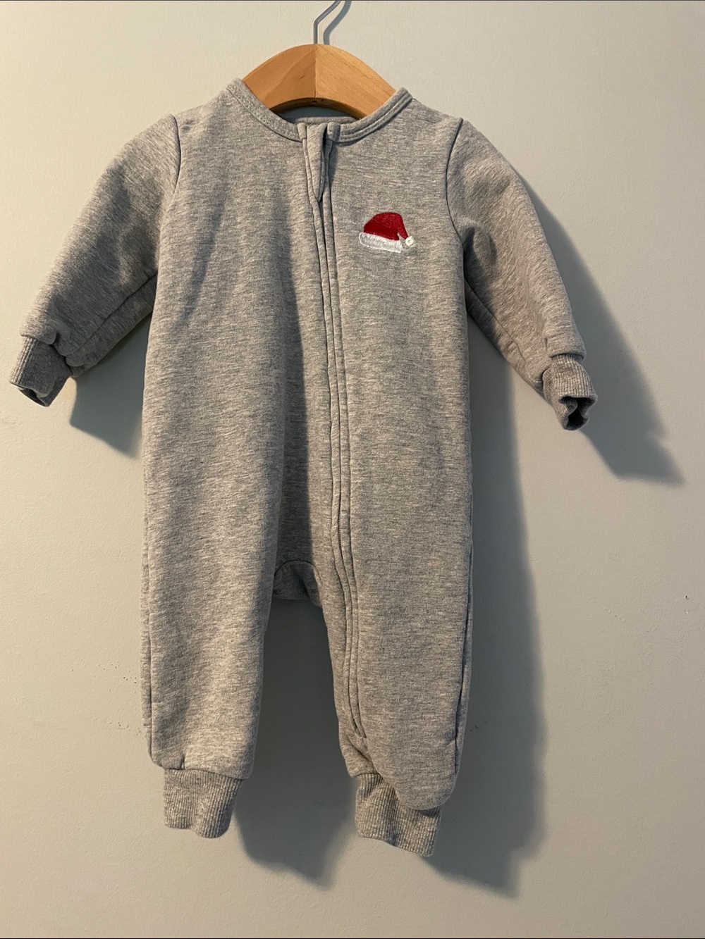 Petit Lem Gray Footed Baby One-Piece with Red Santa Hat Embroidery.